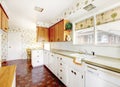 White and brown kitchen interior with tile and floral patterned Royalty Free Stock Photo