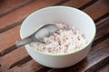 White and brown steamed rice in white round bowl