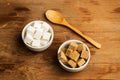 White and brown sugar cubes in white ceramic bowls Royalty Free Stock Photo