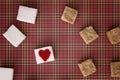 White and brown sugar cubes with a red heart on one of them. Top view. Diet unhealty sweet addiction concept Royalty Free Stock Photo