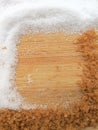 White and brown sugar frame on wooden background Royalty Free Stock Photo