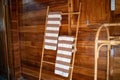 White and brown towels hanging on bamboo made clothesline