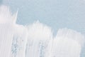 White brush strokes texture on light blue paper background. macro Royalty Free Stock Photo