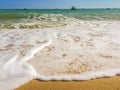 White bubbles created on the beach by ocean waves on seashore Foam bubbles abstract white background. Detergent white foam with s