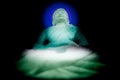 White Buddha statue with dark background Royalty Free Stock Photo
