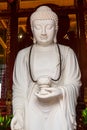 White buddha statue in Longhua Temple in Shanghai, China. Famous buddhist temple in China Royalty Free Stock Photo