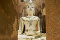 White Buddha statue in Wat Sri Chum temple in Sukhothai Historical park in Sukhothai, Thailand.