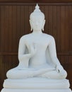 White buddha on wooden background Royalty Free Stock Photo