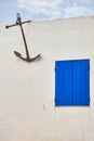 White building facade blue window. Mediterranean style. Decorative anchor. Spain Royalty Free Stock Photo