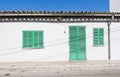 White building with green shutters in El Terreno Royalty Free Stock Photo