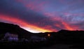 White building at late afternoon with impressive orange and red sky in Copahue, NeuquÃÂ©n, Argentina.