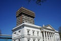 white building with many windows and pillars under a blue sky Royalty Free Stock Photo