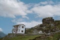 White building on the rocky hillside in the Uttrakhand