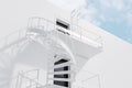 White building with spiral fire escape stairs side Royalty Free Stock Photo