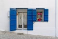 Typical greek house window with shutters, architectural decorative exterior detail