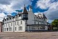 White buildings typical of the seaside village of Ullapool in Scotland, UK. Royalty Free Stock Photo