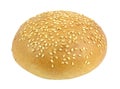 White bun with sesame seeds round whole for a Burger isolated on white background with clipping path. Full depth of field