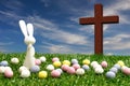 A white bunny, easter eggs and a cross