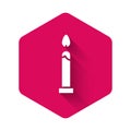White Burning candle icon isolated with long shadow. Cylindrical candle stick with burning flame. Pink hexagon button Royalty Free Stock Photo