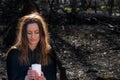 White burning Candle in woman`s hands in the middle of the forest. Hope and Pray concept. All Saints Day celebration. Witchcraft Royalty Free Stock Photo