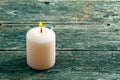 White burning candle on wooden background Royalty Free Stock Photo