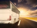 White bus in fast driving on an empty asphalt road Royalty Free Stock Photo