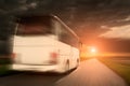 White bus in speed driving on an empty asphalt road Royalty Free Stock Photo