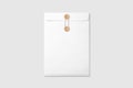 White A4 C4 size String and Brown Washer Envelope Mockup on light grey background. Royalty Free Stock Photo