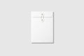 White A5 C5 size String and Washer Envelope Mockup on light grey background Royalty Free Stock Photo