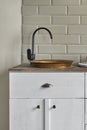 White cabinets with copper sink at kitchen counter residential house. Royalty Free Stock Photo