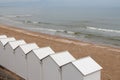 White cabins were placed on a beach (France)