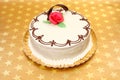 White cake on golden stars background Royalty Free Stock Photo