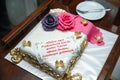 A white cake made for Hari . pink and purple cake . By God`s command, with the permission of the Prophet, we have come to ask for