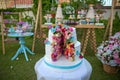 Two-layer cake . Wedding cake decorated with colorfull roses. Celebration party concept. flowers in the middle of the place where Royalty Free Stock Photo