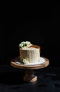 White cake on a wooden stand