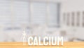 The white calcium text and Skeleton on wood table 3d rendering Royalty Free Stock Photo