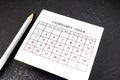 White calendar page for February 2024 and pencil on black Royalty Free Stock Photo