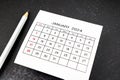 White calendar page for January 2024 and pencil Royalty Free Stock Photo