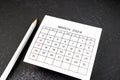 White calendar page for March 2024 and pencil on black Royalty Free Stock Photo