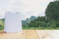 White calendar on wood table on nature background