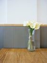 White Calla Lilly flowers in glass vase on Table Royalty Free Stock Photo