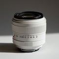 White camera lens with a sleek, cylindrical design. It features a textured focus ring Royalty Free Stock Photo