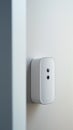 A white camera mounted on the wall of a room, AI
