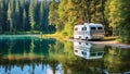 White camper by beautiful lake and trees.Travel motorhome family car camping truck summer holiday,travel concept