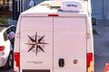 White camper van with compass design and satellite dish in urban setting. August 12, 2025 Istanbul Turkey Royalty Free Stock Photo