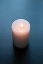 White candle on a black background, Royalty Free Stock Photo