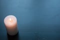 White candle on a black background, Royalty Free Stock Photo