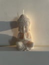 white candle Buddha