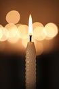 White candle on dark background Royalty Free Stock Photo