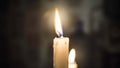 White candle flame at night. Royalty Free Stock Photo